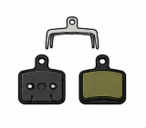 Brake pad replacement process showing new brake pads and caliper assembly
