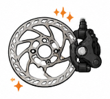 Bicycle disc brake being trued for smooth braking and reduced rubbing