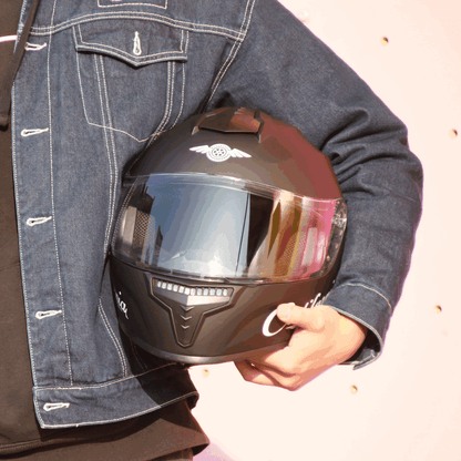 Freego California helmet held by rider, front view
