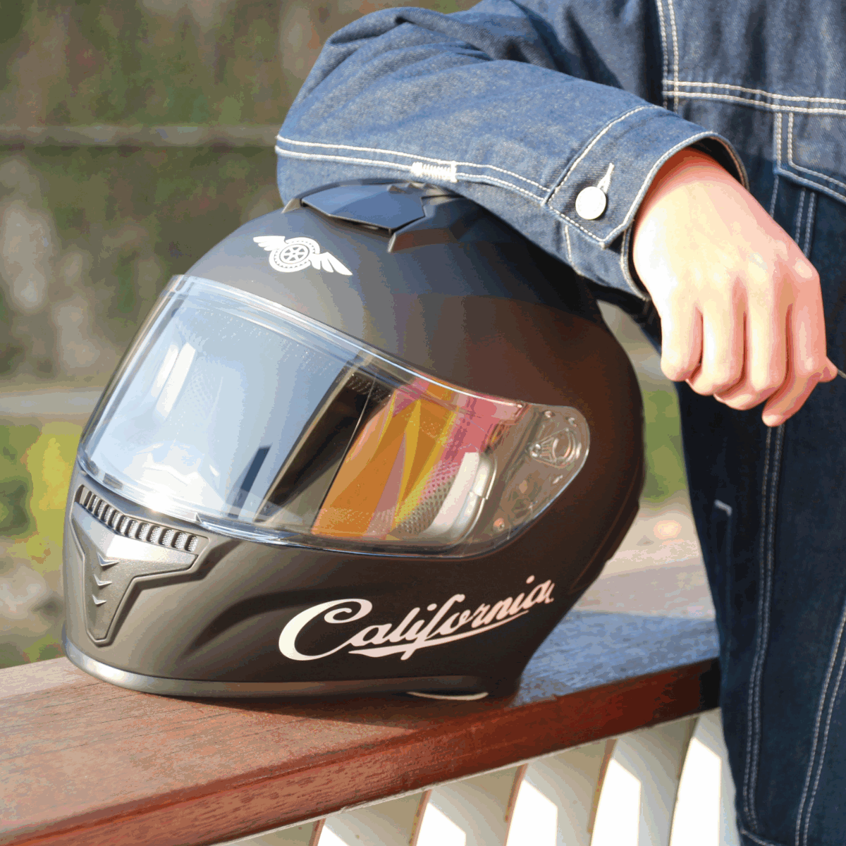 Freego California helmet resting on outdoor railing