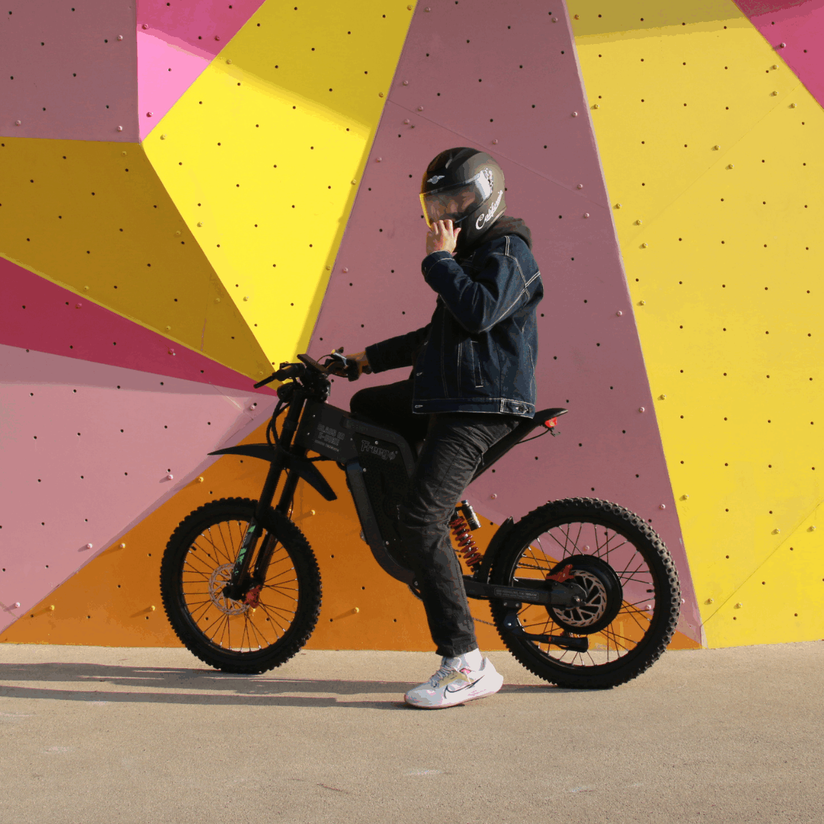  Freego electric dirt bike with rider wearing matching helmet